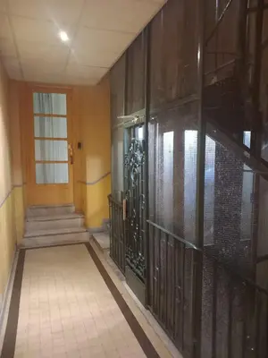 a hallway with a wrought iron gate in a building at Studio Emmé neuf indépendant Nice Centre in Nice
