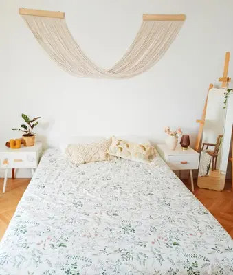 a bedroom with a large bed with a large window at Arty room in Nice