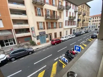 a view of a city street with parked cars at Grand Studio très bien situé! in Nice