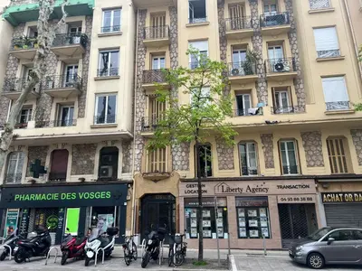 a large building with motorcycles parked in front of it at Appartement Nice 2 chambre 2 lits 1 salle de bain in Nice