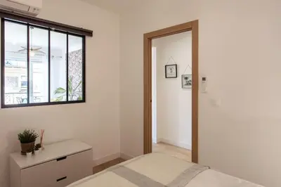 a bedroom with a bed and a dresser and a window at L53 1BR Hotel des Postes, Place Massena Terrace & AC in Nice