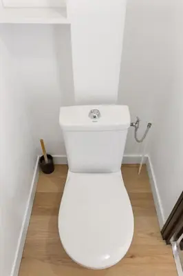 a bathroom with a white toilet in a room at Le Mimosa - Calm - Spacious - 200m from the sea - Parking in Cagnes-sur-Mer
