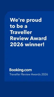 a blue sign that says were proud to be a traveller reviewagency winner at THE GREEN OASIS breathtaking sea views, swimming pool, privacy in Villa Liliana in Tourrette-Levens