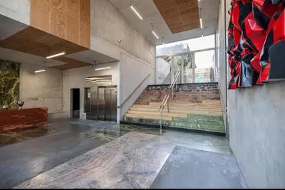 an empty room with a staircase in a building at Appartement nice in Nice