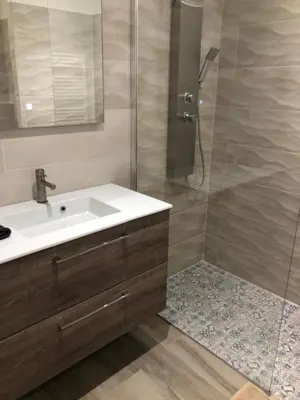 a bathroom with a sink and a shower at Eros in Nice