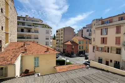 a view from the roof of a city with buildings at Apartment 3 pieces par la mer avec climatisation in Nice