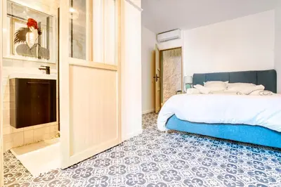 a bedroom with a bed and a bathroom at New vieille ville cimiez Centre Nice in Nice