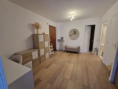 an empty living room with wooden floors and white walls at Charmant 2 pièces Centre Ville in Nice