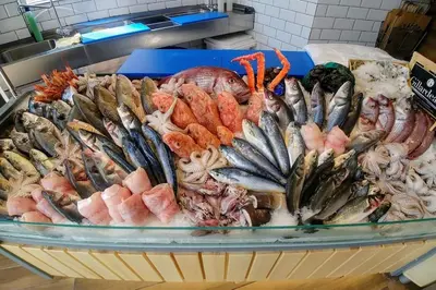 a bunch of different types of seafood in a basket at 86m- Spacious 3 room apartment with large terrace in Villefranche-sur-Mer