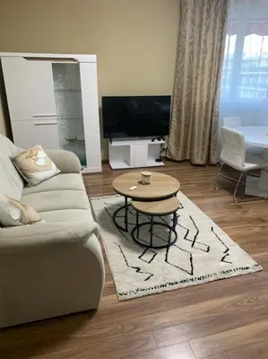 a living room with a couch and a coffee table at Magnifique 2 pièces à 2 pas de la mer in Nice