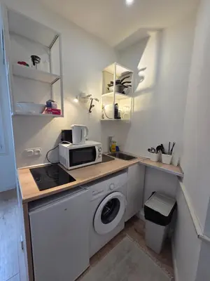 a white ceiling with a white object in a bathroom at Studio Niçois Proche Mer in Nice
