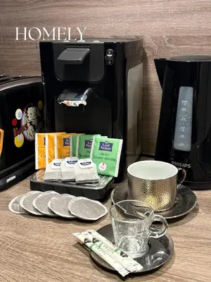 a counter top with a coffee maker and a coffee cup at Appt Nice-Centre avec Parking Privé proche Promenade des Anglais in Nice