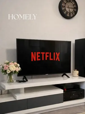 a flat screen tv sitting on top of a white entertainment center at Appt Nice-Centre avec Parking Privé proche Promenade des Anglais in Nice