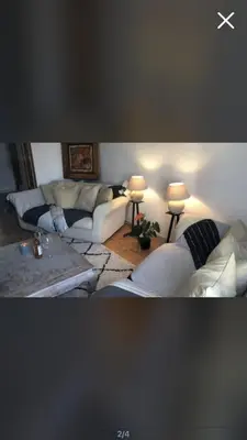 a living room with two couches and a table at Room near Nice Port in a shared apartment in Nice