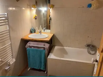 a bathroom with a sink and a bath tub at Room near Nice Port in a shared apartment in Nice