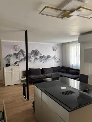 a living room with a couch and a table at Appartement confortable et cosy sur le port de Nice in Nice