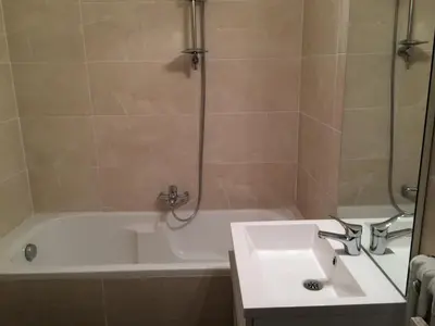 a bathroom with a tub and a sink and a shower at Nice Halevy in Nice