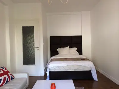 a bedroom with a bed and a couch at Nice Halevy in Nice