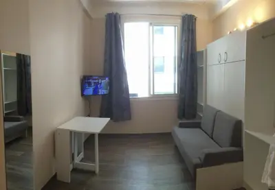 a small living room with a couch and a window at Nice Halevy in Nice