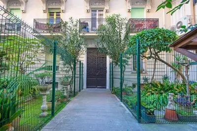 a gate in front of a building with plants at - - Superbe Studio avec Balcon - Nice Centre - - in Nice