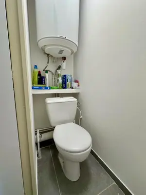 a small bathroom with a white toilet in a room at Side Ocean View Studio, 24H Check-In and Out, Air Conditioner, Close to Airport in Cagnes-sur-Mer
