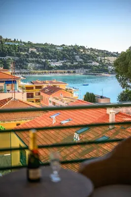 a view from the roof of a building with a beach at 4 pièces vue mer, 6 pers, balcon, WiFi, garage in Villefranche-sur-Mer