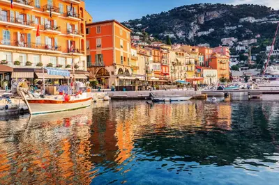 a group of buildings and boats in a body of water at 4 pièces vue mer, 6 pers, balcon, WiFi, garage in Villefranche-sur-Mer