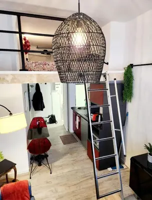 a room with a bunk bed and a ladder at Studio au coeur du centre ville de Nice in Nice