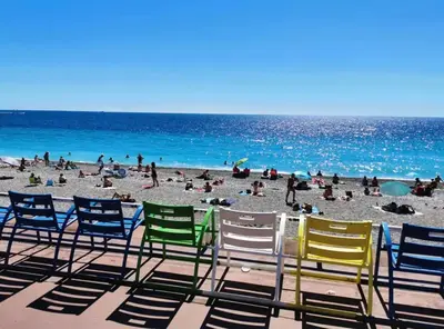 a group of lawn chairs sitting on a beach at Studio au coeur du centre ville de Nice in Nice