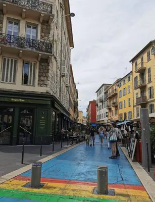 a street with a rainbow painted on the ground at Studio au coeur du centre ville de Nice in Nice