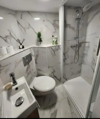 a bathroom with a toilet and a shower and a sink at Studio au coeur du centre ville de Nice in Nice