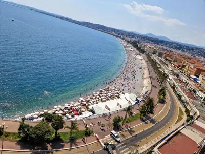 an aerial view of a beach with umbrellas and people at Magnifique appartement 2 pièces - Port de Nice in Nice