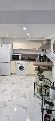 a kitchen with a washer and dryer at Magnifique appartement 2 pièces - Port de Nice in Nice