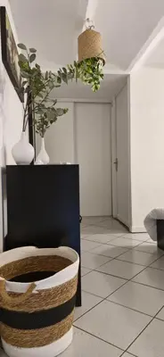 a living room with a basket and vases on the ceiling at Magnifique appartement 2 pièces - Port de Nice in Nice