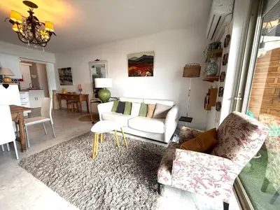 a living room with two chairs and a couch at t3 cagnes sur mer in Cagnes-sur-Mer