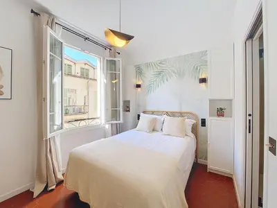 a bedroom with a white bed and a window at Nestor&Jeeves - FEI HOME - Port - Modern in Nice