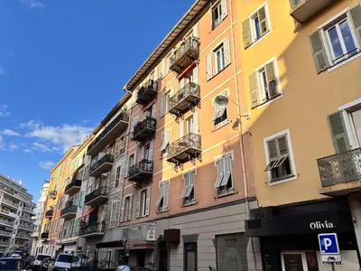 a tall building with windows and balconies on a street at Ze Perfect Place - Splendide Appart 2 Chb Garibaldi in Nice
