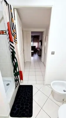 a bathroom with a shower and a black rug at Sunny Escape in Nice