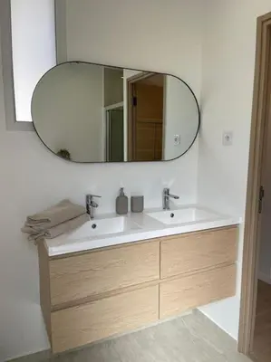 a bathroom with a sink and a mirror at Appartement à 2 pas de la mer et Parking privé in Nice