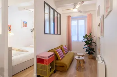 a living room with a couch and a bed at L59 Appartment La Loge Vieux Nice, central AC & WIFI in Nice