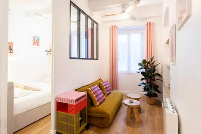 a living room with a couch and a bed at L59 Appartment La Loge Vieux Nice, central AC & WIFI in Nice