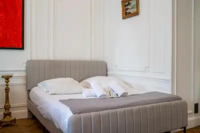 a bed with two towels on it in a room at Appartement Belle Époque cœur de ville -AC- in Nice