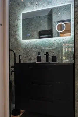 a bathroom with a black dresser and a mirror at Appartement Belle Époque cœur de ville -AC- in Nice