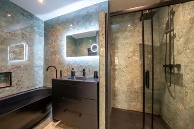 a bathroom with a sink and a shower at Appartement Belle Époque cœur de ville -AC- in Nice