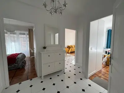 a room with a white dresser and a mirror at Sunny Gambetta with 3 air conditionings in Nice