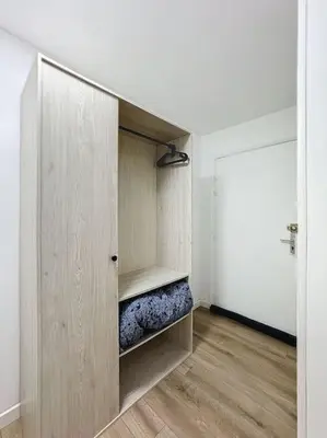 a room with a closet with a bed in it at Studio proche mer - Climatisé in Cagnes-sur-Mer