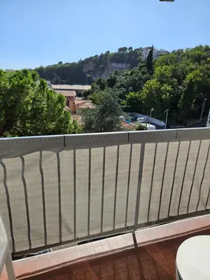 a white fence on a balcony with a view at L'escapade vers le bien-être in Nice