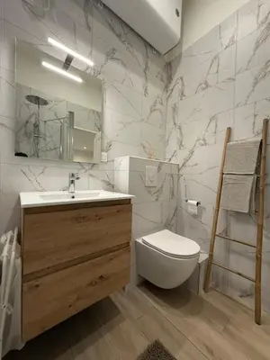 a bathroom with a toilet and a sink and a mirror at Studio Roma - Jean Médecin - LA RIVIERA LCD in Nice