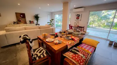 a small room with a bed and a shower at Maison LeFleur - Villa avec piscine sur les hauteurs de Nice in Nice