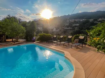 a living room with two couches and a table at Maison LeFleur - Villa avec piscine sur les hauteurs de Nice in Nice
